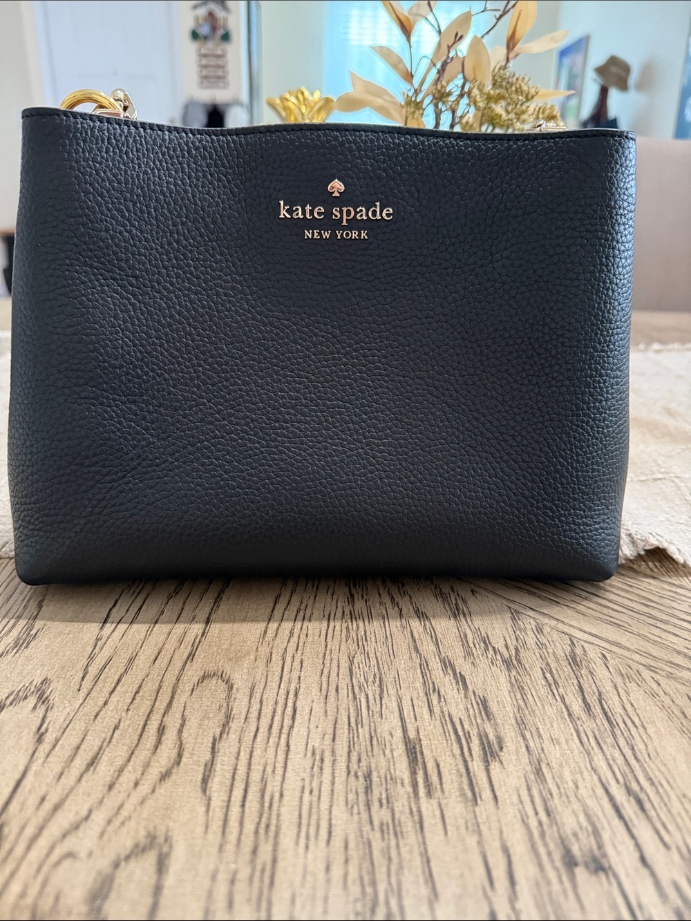 kate spade black pebbled leather crossbody with gold-tone logo